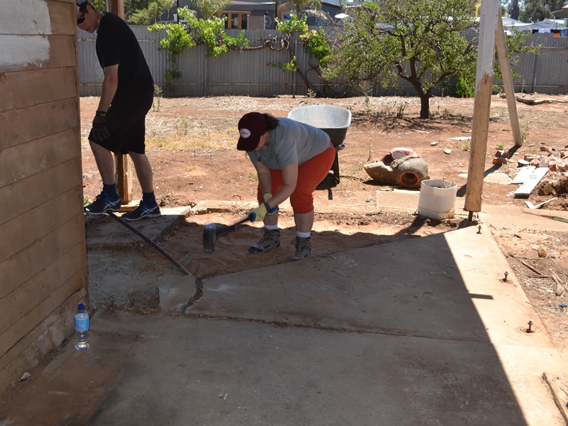 Matthew and Abbey breaking up concrete